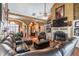 Large living room with a sectional sofa, hardwood floors, and a fireplace at 570 Pleasant Grove Rd, Mcdonough, GA 30252
