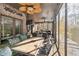 Enjoy this screened porch with a dining table and seating at 570 Pleasant Grove Rd, Mcdonough, GA 30252