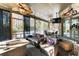 Relaxing screened porch with seating area and a fireplace at 570 Pleasant Grove Rd, Mcdonough, GA 30252