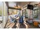 Screened porch with dining area and outdoor seating at 570 Pleasant Grove Rd, Mcdonough, GA 30252