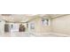 Spacious unfinished basement with large windows and tiled floors at 206 Woodridge Pkwy, Canton, GA 30115