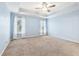 Spacious bedroom with light blue walls and neutral carpeting at 206 Woodridge Pkwy, Canton, GA 30115