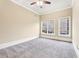 Bright bedroom with neutral carpeting and two large windows at 206 Woodridge Pkwy, Canton, GA 30115
