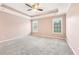 Spacious bedroom with natural light and ceiling fan at 206 Woodridge Pkwy, Canton, GA 30115