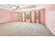 Large bedroom with neutral walls and ceiling fan at 206 Woodridge Pkwy, Canton, GA 30115