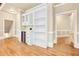Butlers pantry with white cabinets, wine cooler, and shelving at 206 Woodridge Pkwy, Canton, GA 30115