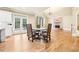 Formal dining room adjacent to kitchen with hardwood floors and fireplace at 206 Woodridge Pkwy, Canton, GA 30115