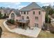 Brick house with a deck and patio at 206 Woodridge Pkwy, Canton, GA 30115