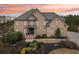 Two story brick house with landscaping at 206 Woodridge Pkwy, Canton, GA 30115