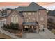 Brick house with deck and patio at dusk at 206 Woodridge Pkwy, Canton, GA 30115