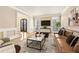 Living room with hardwood floors and large windows at 206 Woodridge Pkwy, Canton, GA 30115
