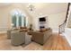 Spacious living room with hardwood floors, fireplace, and large window at 206 Woodridge Pkwy, Canton, GA 30115