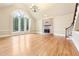 Bright living room with hardwood floors, fireplace and large window at 206 Woodridge Pkwy, Canton, GA 30115