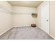 Large walk-in closet with wire shelving and neutral carpeting at 206 Woodridge Pkwy, Canton, GA 30115