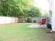 Fenced backyard with patio and lawn at 517 Carrington Ct, Canton, GA 30115