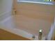 Clean bathroom with a bathtub at 517 Carrington Ct, Canton, GA 30115