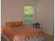 Bedroom with window and carpeted floor at 517 Carrington Ct, Canton, GA 30115