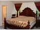 Main bedroom with large bed and ensuite bathroom at 517 Carrington Ct, Canton, GA 30115