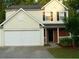 Two-story house with attached garage and landscaping at 517 Carrington Ct, Canton, GA 30115