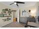 Cozy Bedroom with carpet, ceiling fan, and decorative shelving for books and toys at 2230 Mcbrayer Ct, Cumming, GA 30028