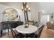 Elegant dining area featuring hardwood floors, stylish furnishings, and views into the connected living spaces at 2230 Mcbrayer Ct, Cumming, GA 30028