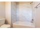 Clean bathroom with a bathtub and marble tile at 3485 Tarragon Dr, Decatur, GA 30034