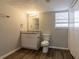 Simple bathroom with granite countertop, white vanity, and vinyl flooring at 3485 Tarragon Dr, Decatur, GA 30034