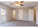 Primary bedroom with private balcony and ceiling fan at 3485 Tarragon Dr, Decatur, GA 30034