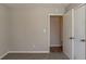 Simple bedroom with grey walls and carpet flooring at 3485 Tarragon Dr, Decatur, GA 30034
