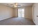 Primary bedroom with balcony access and ceiling fan at 3485 Tarragon Dr, Decatur, GA 30034