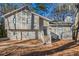 Gray two-story house with white accents and stone detailing at 3485 Tarragon Dr, Decatur, GA 30034