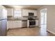 Updated kitchen featuring white cabinets, stainless steel appliances and granite at 3485 Tarragon Dr, Decatur, GA 30034