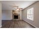 Living room with stone fireplace, hardwood floors and ceiling fan at 3485 Tarragon Dr, Decatur, GA 30034