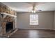 Living room featuring a stone fireplace and hardwood flooring at 3485 Tarragon Dr, Decatur, GA 30034