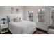 Bright bedroom with a comfortable queen-size bed and plenty of natural light at 4724 Cypress Commons # 702, Atlanta, GA 30338