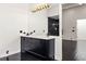 Elegant bathroom with a modern vanity and gold light fixture at 4377 Paran Nw Pl, Atlanta, GA 30327