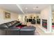 Spacious basement recreation room with wet bar and fireplace at 1120 Heards Ferry Rd, Sandy Springs, GA 30328