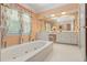 Bathroom with double vanity, jetted tub, and hexagonal tile floor at 1120 Heards Ferry Rd, Sandy Springs, GA 30328