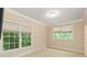 Well-lit bedroom with large windows and neutral wall colors at 1120 Heards Ferry Rd, Sandy Springs, GA 30328