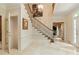 Bright entryway with a staircase, tiled floors, and coat closet at 1120 Heards Ferry Rd, Sandy Springs, GA 30328