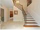 Elegant entryway with a grand staircase and marble floors at 1120 Heards Ferry Rd, Sandy Springs, GA 30328