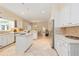 Bright kitchen with an island, stainless steel appliances, and access to the dining area at 1120 Heards Ferry Rd, Sandy Springs, GA 30328