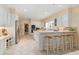 Eat-in kitchen with white cabinets, stainless steel appliances and a breakfast bar at 1120 Heards Ferry Rd, Sandy Springs, GA 30328