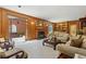 Spacious living room featuring hardwood floors, a fireplace, and built-in shelving at 1120 Heards Ferry Rd, Sandy Springs, GA 30328