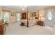 Main bedroom with four-poster bed and large windows at 1120 Heards Ferry Rd, Sandy Springs, GA 30328