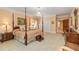 Spacious main bedroom with four-poster bed, ample closet space, and neutral decor at 1120 Heards Ferry Rd, Sandy Springs, GA 30328