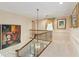 Upstairs hallway with hardwood floors and artwork at 1120 Heards Ferry Rd, Sandy Springs, GA 30328
