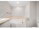 Inviting bathroom featuring a soaking tub and elegant fixtures at 240 Dogwood Dr, Canton, GA 30114