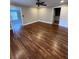 Spacious bedroom with hardwood floors and an ensuite bathroom at 240 Dogwood Dr, Canton, GA 30114