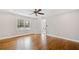 Bright bedroom with hardwood floors, natural light and access to an outdoor patio at 240 Dogwood Dr, Canton, GA 30114
